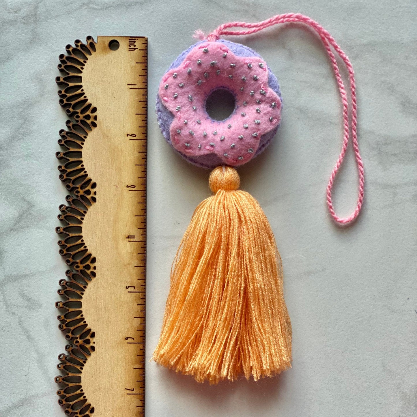 SURPRISE Embroidered Donut Tassel