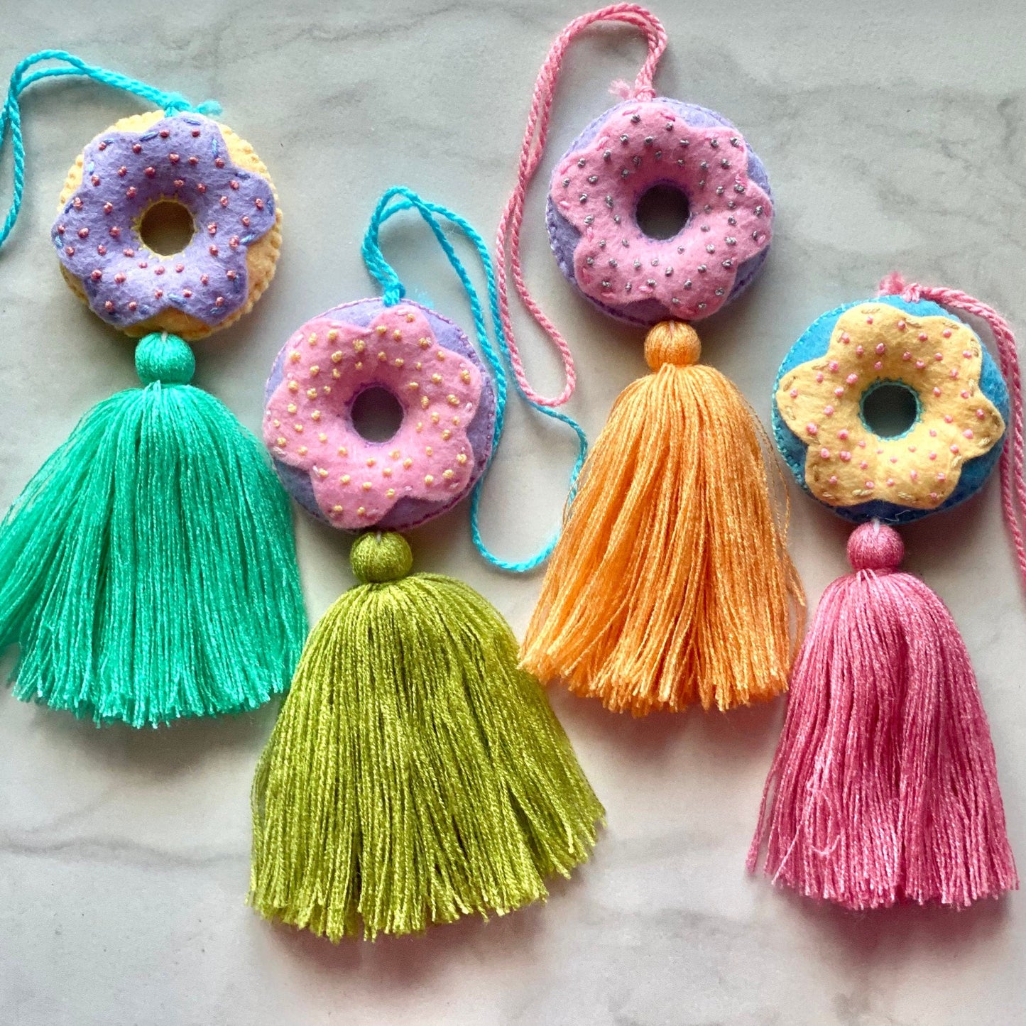 SURPRISE Embroidered Donut Tassel