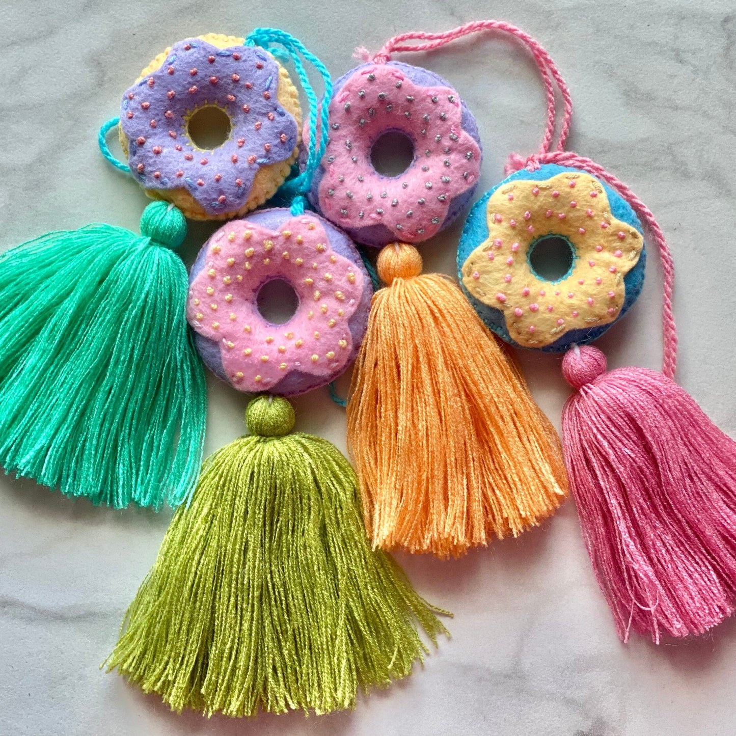 SURPRISE Embroidered Donut Tassel