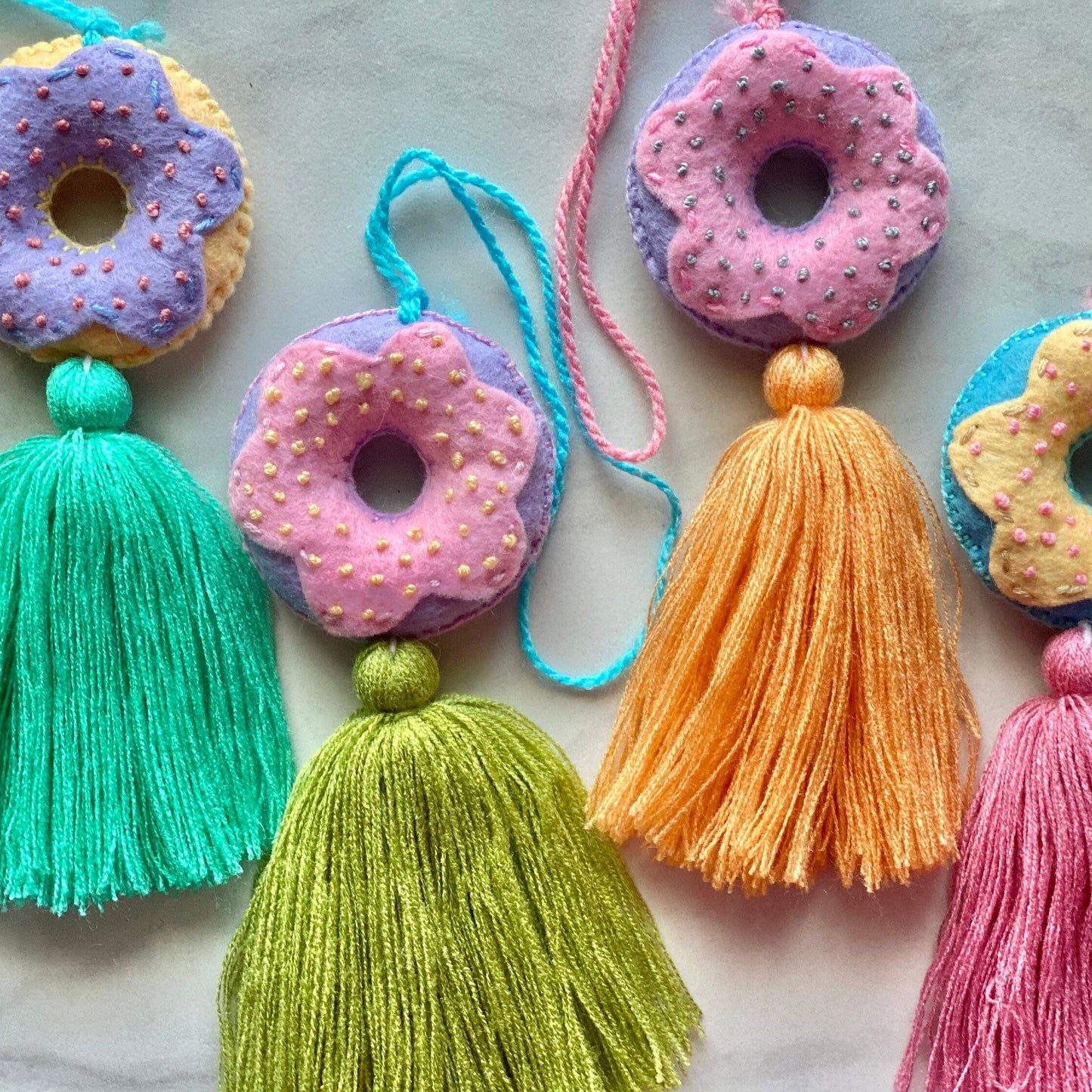 SURPRISE Embroidered Donut Tassel